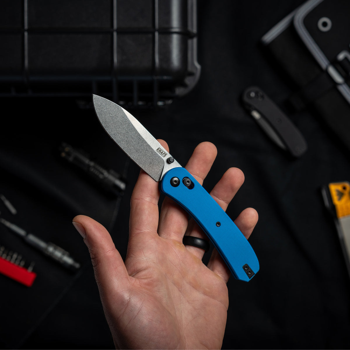 Lander 2 Pocket Knife in Blue G10, open, held in hand