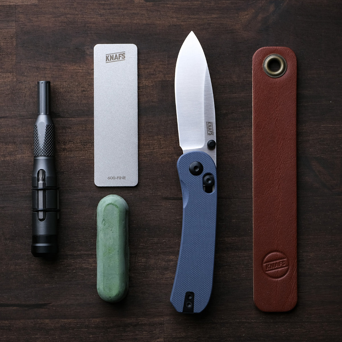 Lander 3 Pocket Knife in Horizon Blue G10 grouped with other EDC items including pens and knives