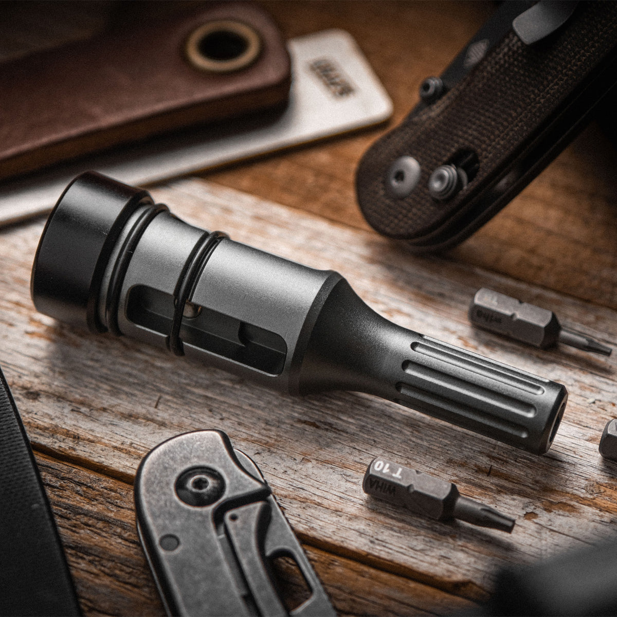 Bit Driver Grande bit driver tool disassembled showing bit storage compartment and knife