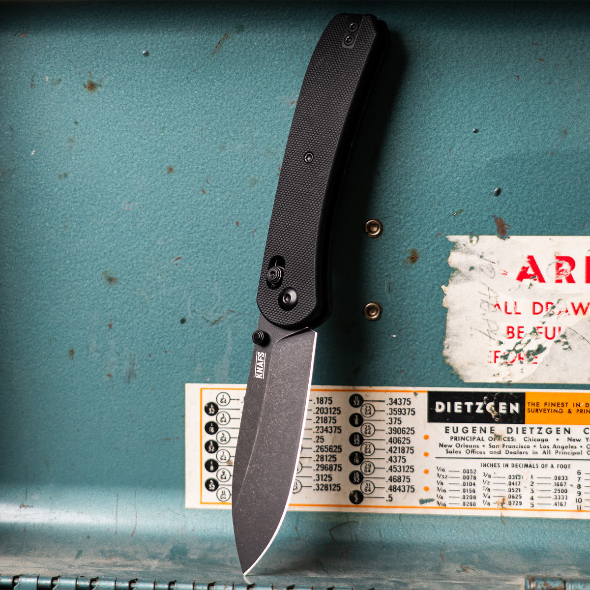 Lander 2 Pocket Knife in Black G10, open, close-up near its packaging