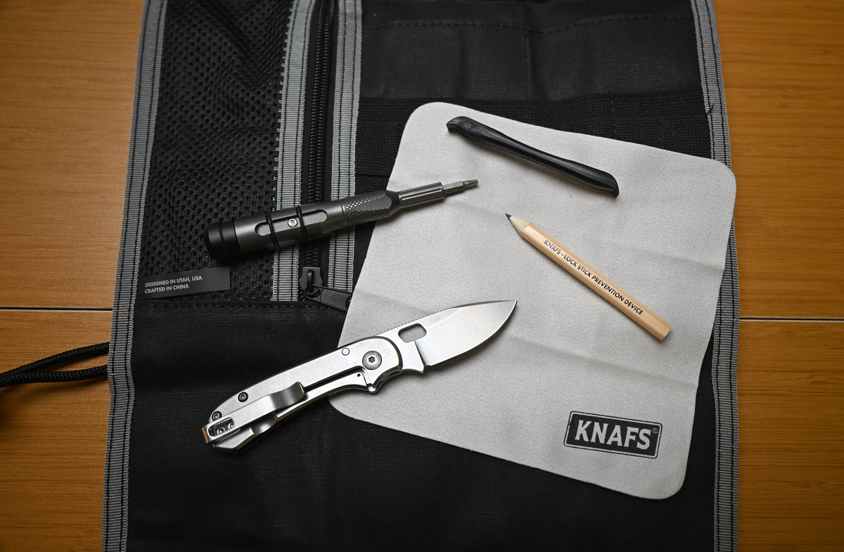 New to Knives bundle contents laid out including knife, pen, sharpener, and case