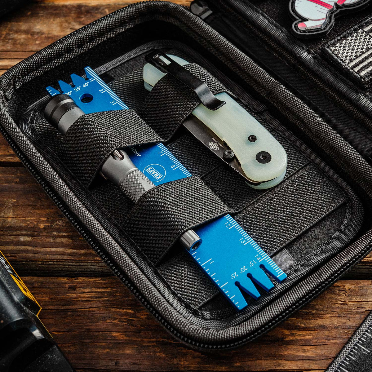 Knafs x Vault Case NANO Knife EDC Case, open, filled with small tools and knife components