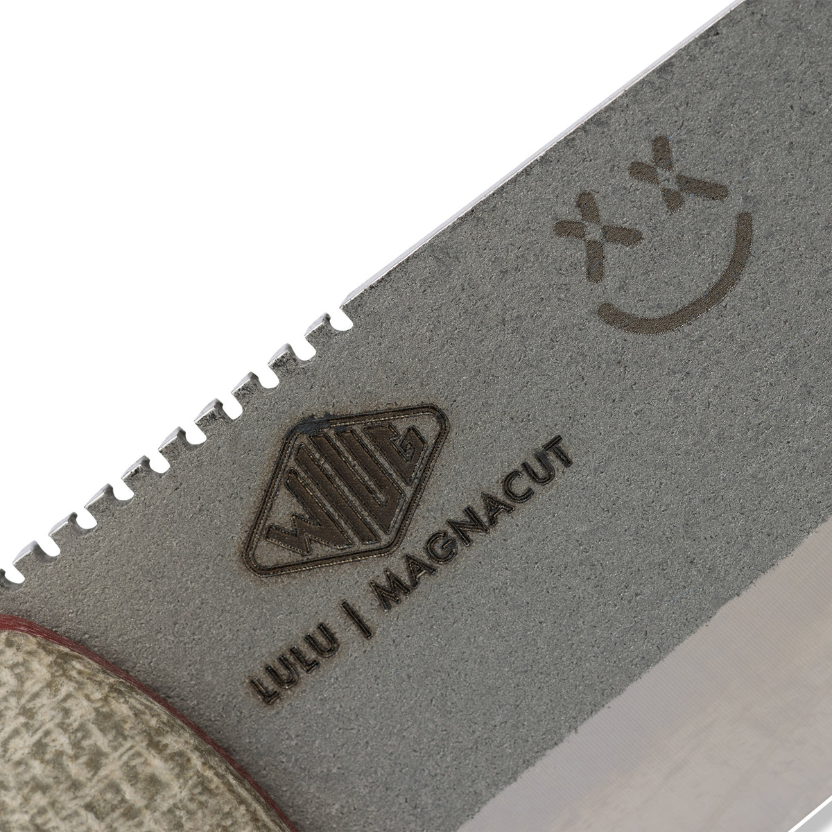 Close-up of blemish mark and Knafs smiley face logo etched into Lulu kydex sheath