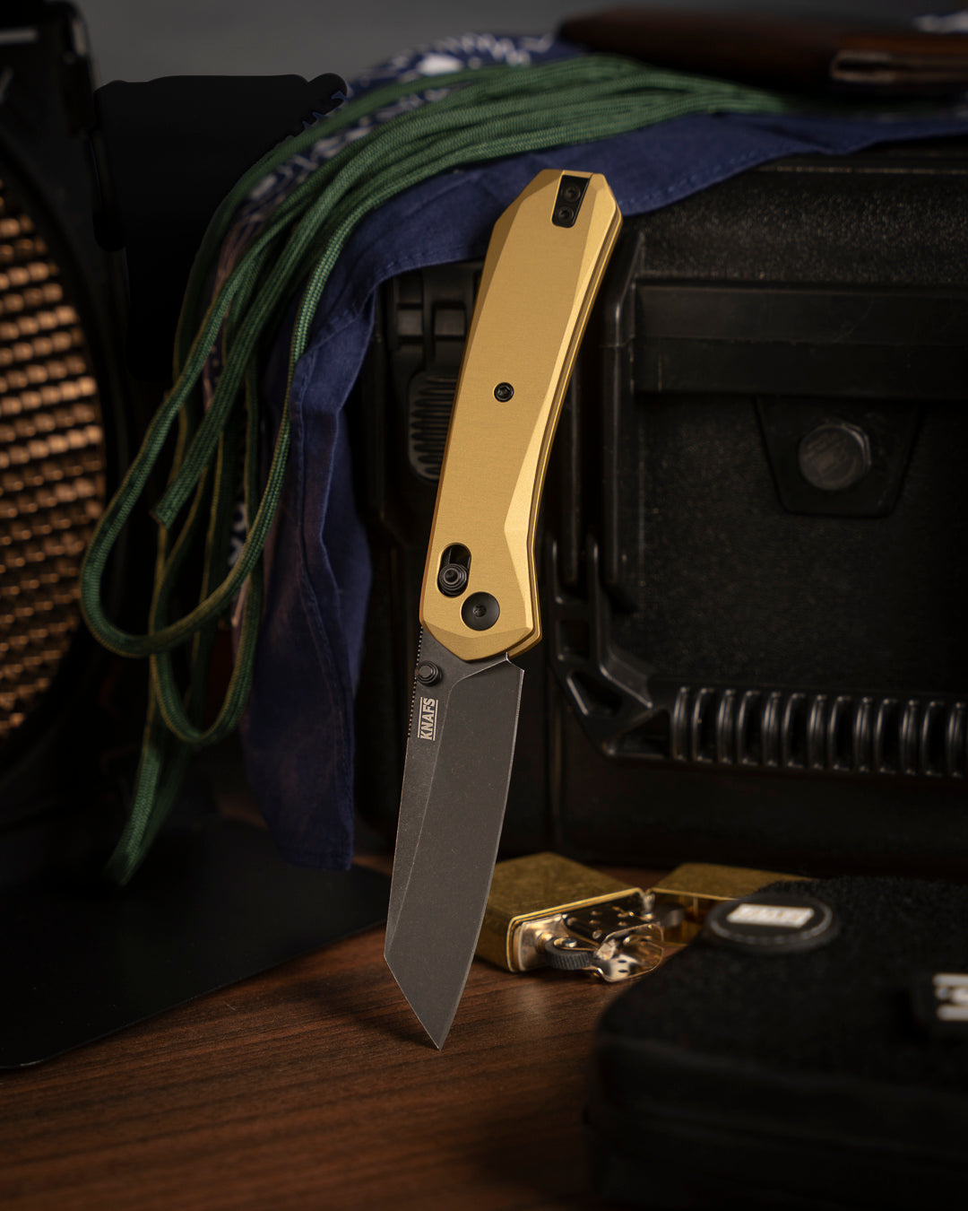 Lander 2 Reverse Tanto pocket knife with gold aluminum handle clipped to fabric strap