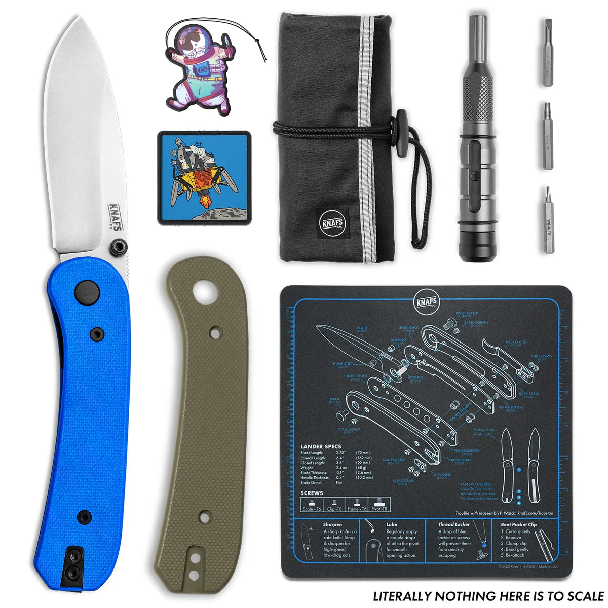New To Knives Lander 1 Bundle flat lay showing the blue knife, patches, pen, and shop mat