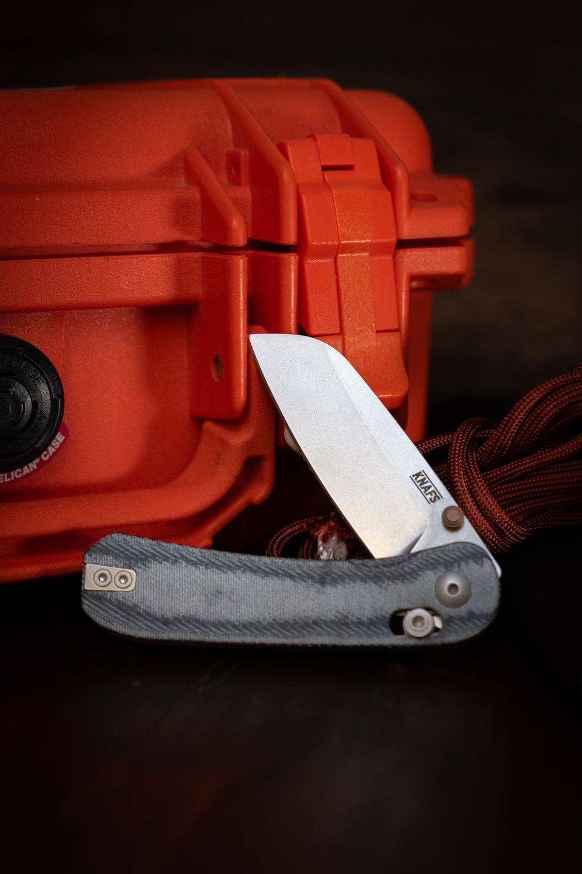 Lander 3 sheepsfoot pocket knife resting on orange hard case