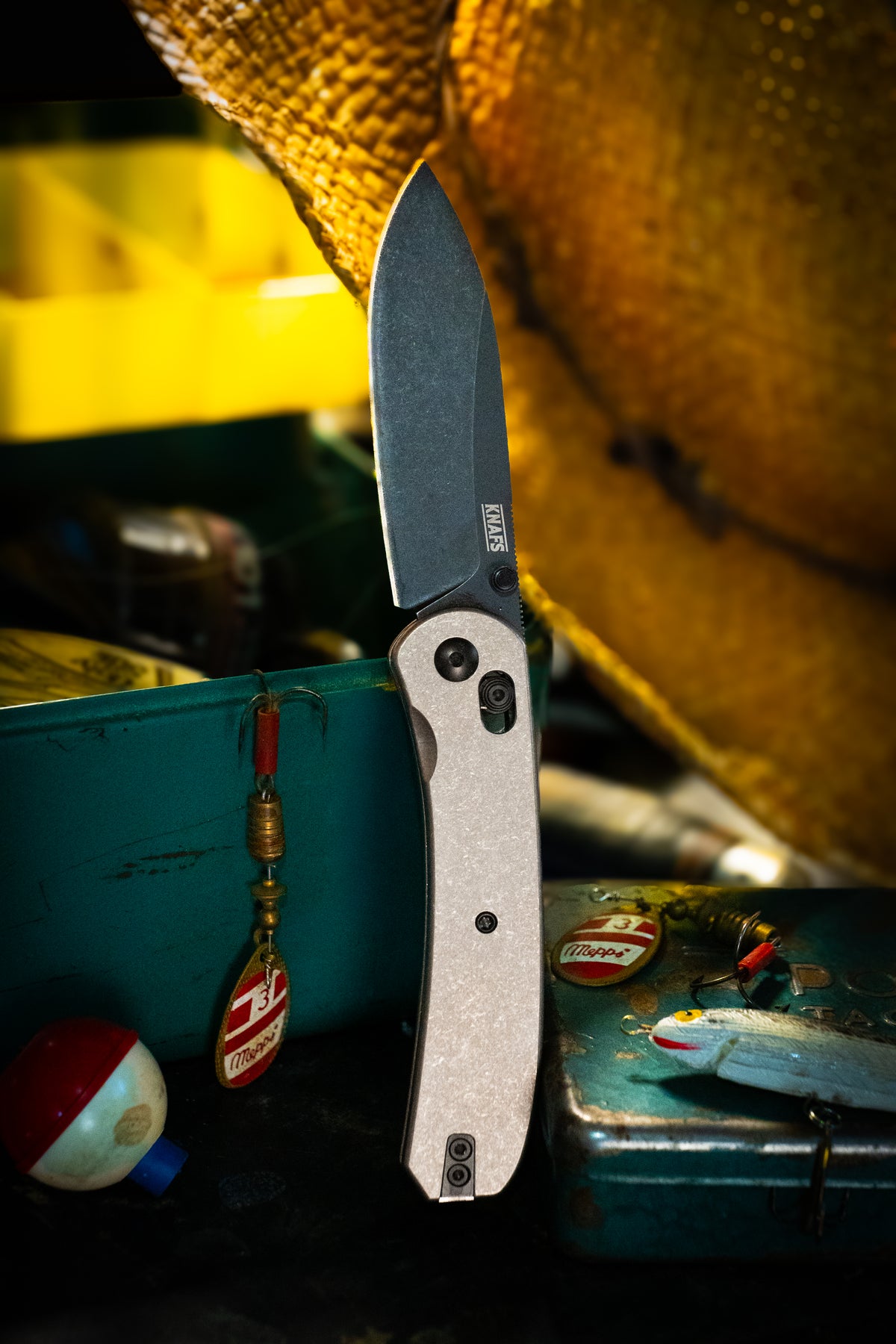 Lander 2 stonewash titanium pocket knife clipped to bag with keychain accessories