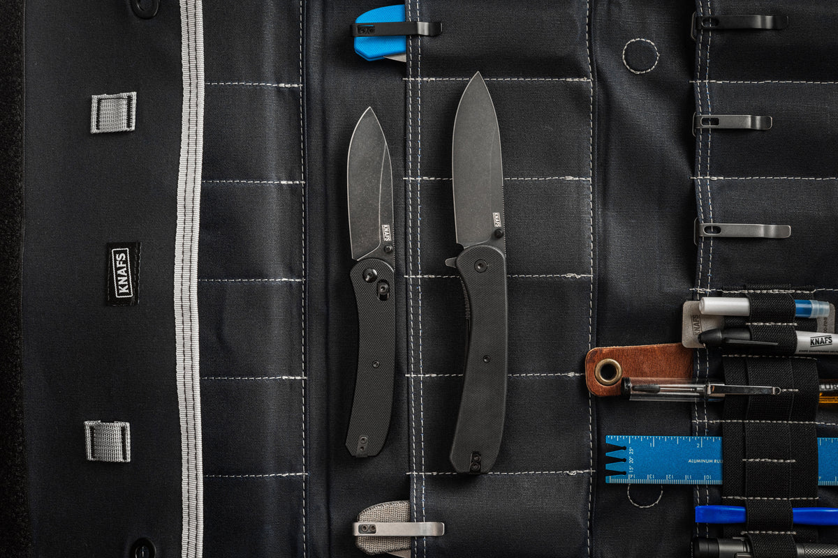 Lander 7 pocket knives with black G10 handles packed in tool case foam insert