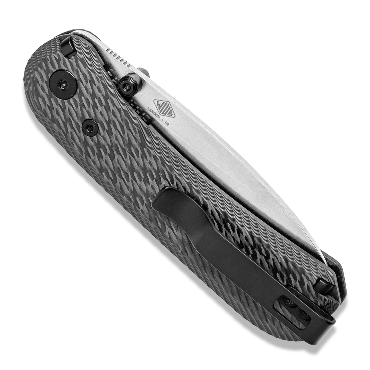 Lander 1 Knife Scales in Bias Carbon Fiber installed on a closed knife, standing upright