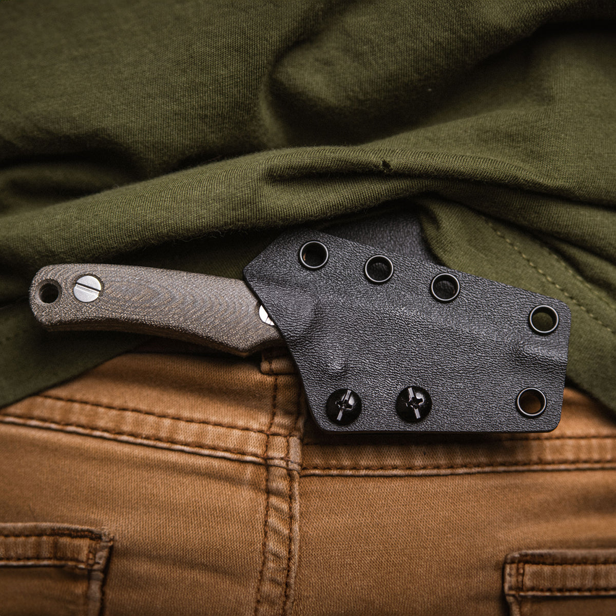 Little Lulu knife in sheath worn in back carry position on waistband