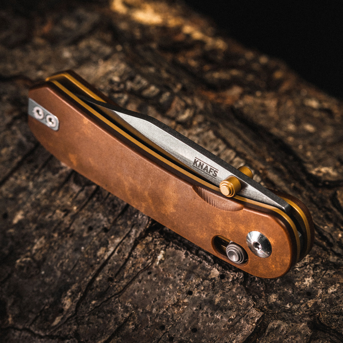 Lander 3 pocket knife with tan handle, closed, showing liner and pivot detail