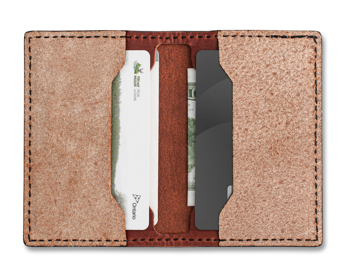 Leather Strop Wallet for Pocket Knives open, showing a folding knife tucked into the card pocket