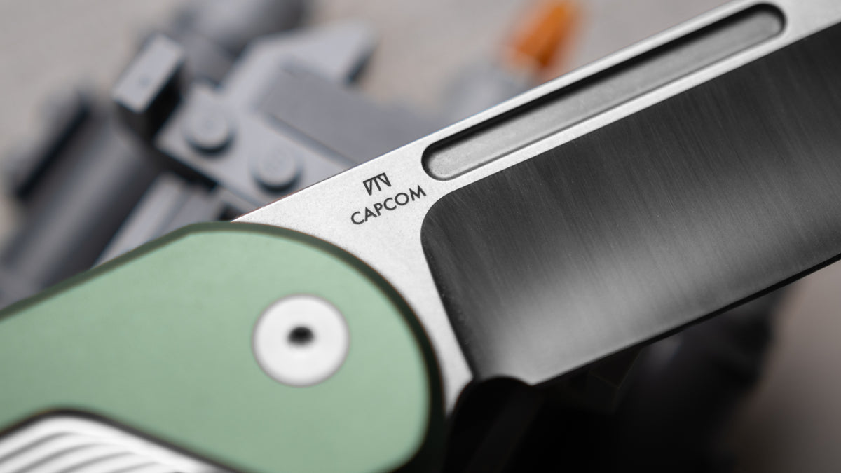 Close-up of Capcom pocket knife maker's mark engraved on blade