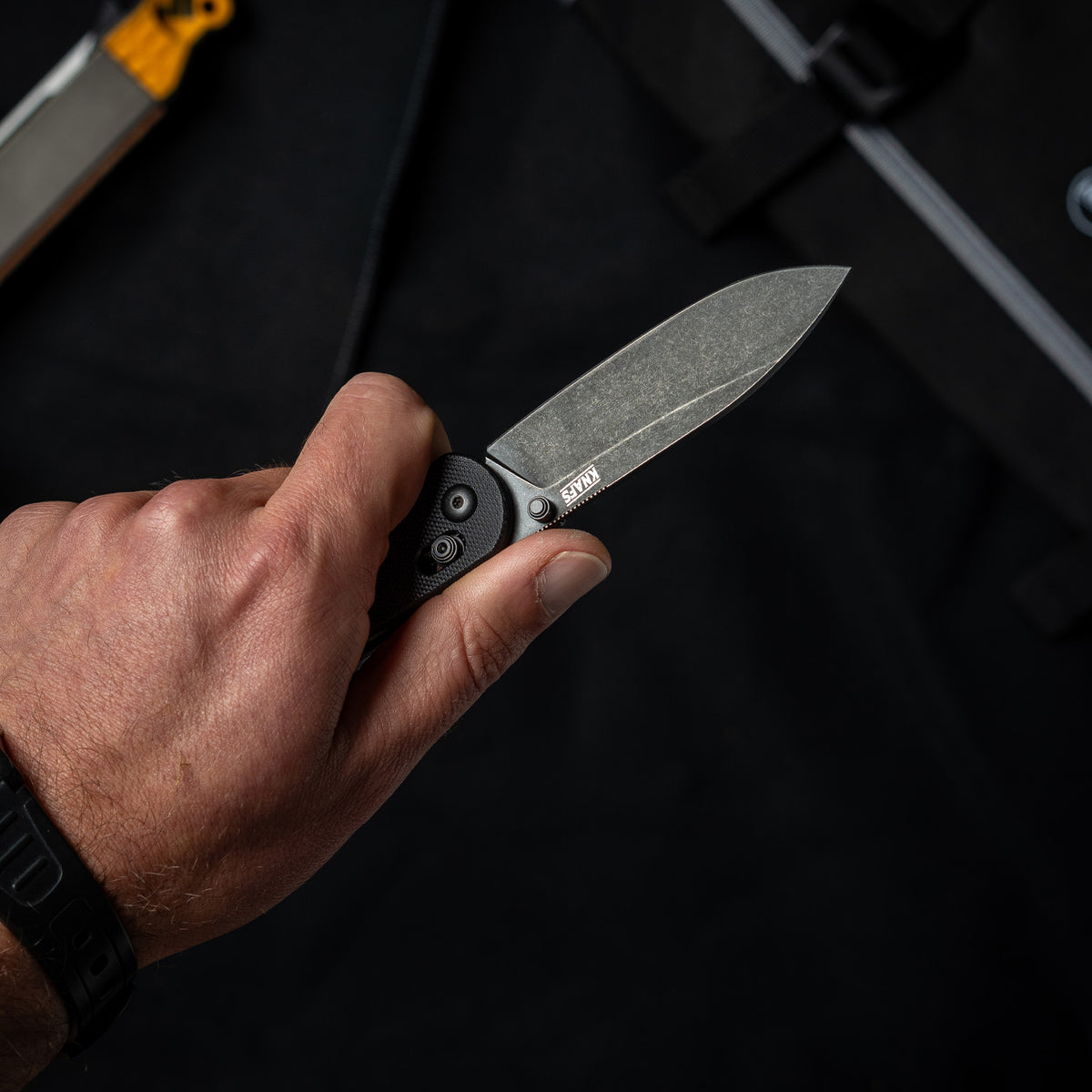 Lander 2 Pocket Knife in Black G10, open, held in hand, close-up