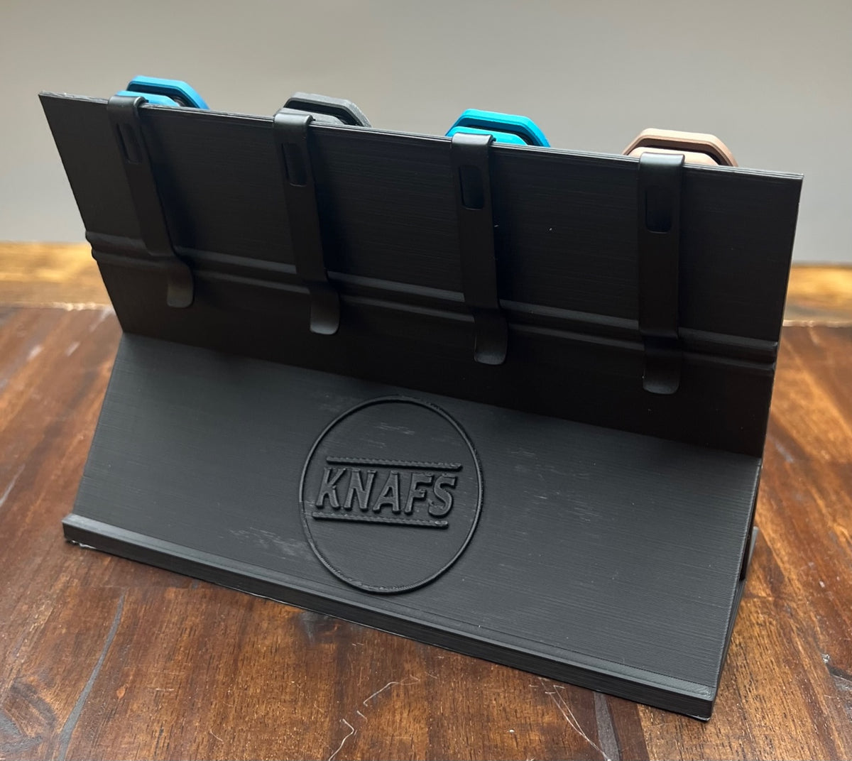 Knife Display Stand 3D print, printed in black and holding a row of knives