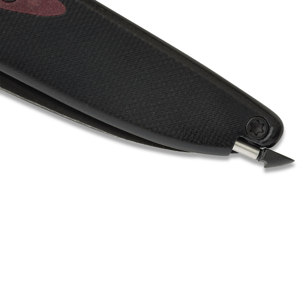 Close-up of Doodler pocket knife pen mechanism partially extended, pointed outward