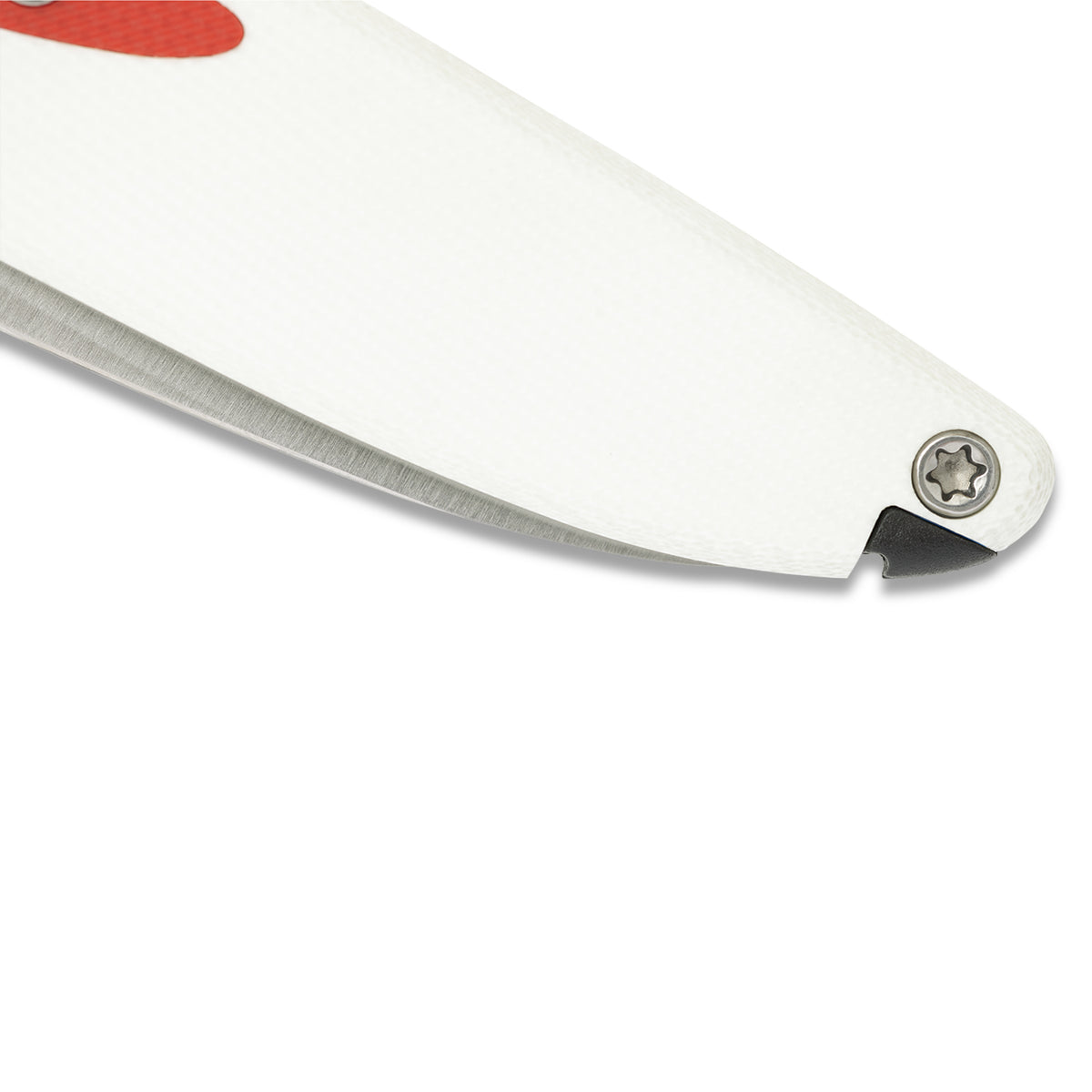 Close-up of Doodler pocket knife pen mechanism partially extended, white and red handle, pointed inward