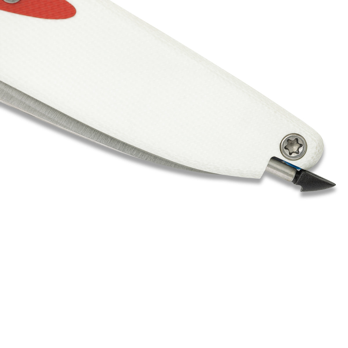 Close-up of Doodler pocket knife pen mechanism partially extended, white and red handle, pointed outward