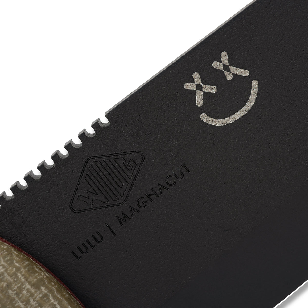 Close-up of blemish mark on black MagnaCut Lulu knife blade