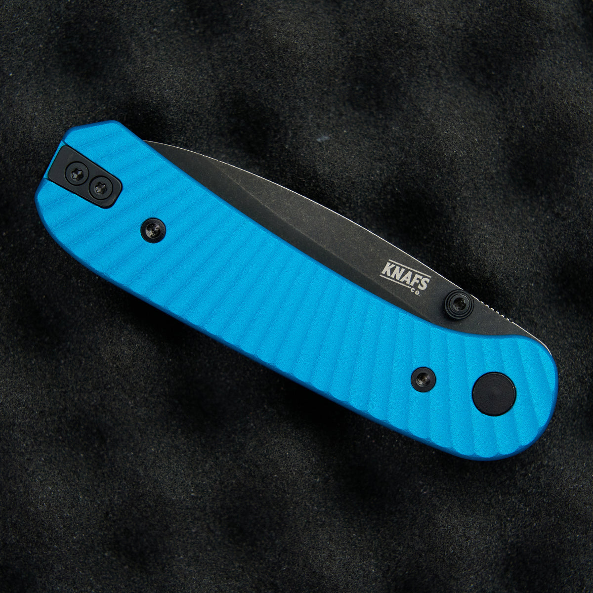 Lander 1 Pocket Knife Limited Edition, closed, lying on a textured surface