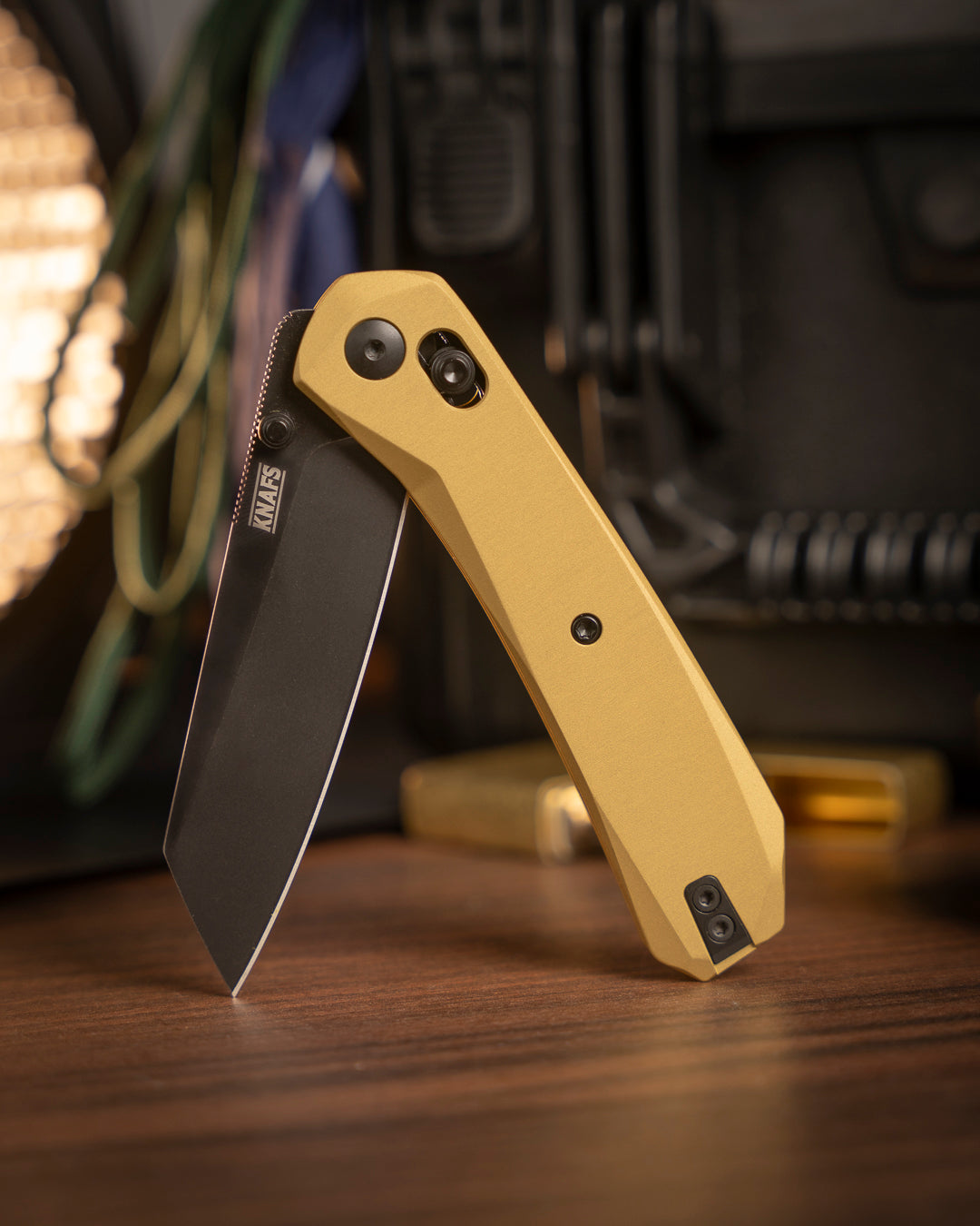 Lander 2 Reverse Tanto pocket knife with gold aluminum handle, closed, angled view