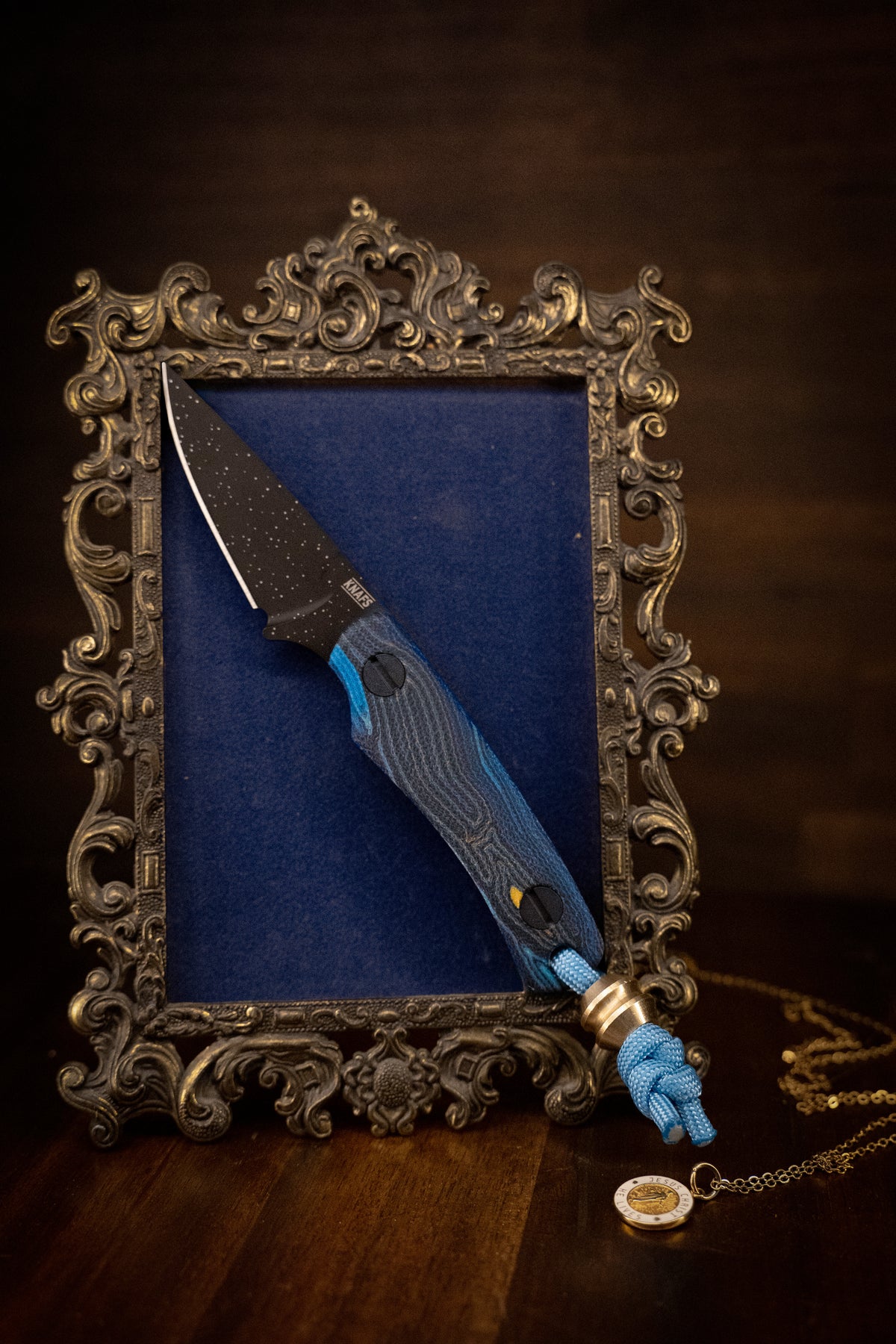 knife posed on a picture frame