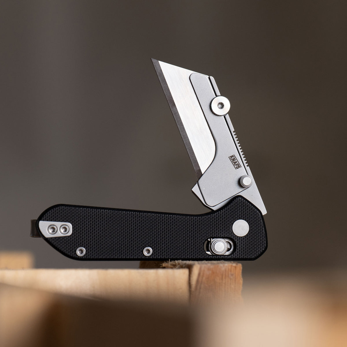 Yuti utility knife with black G10 handle, closed, square product shot