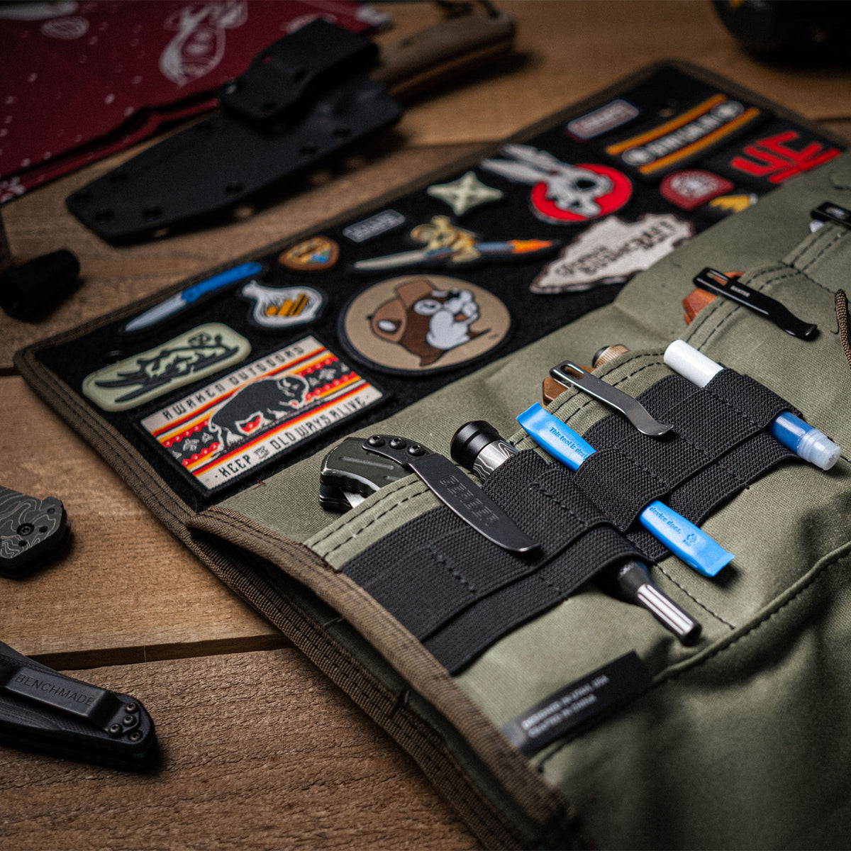 Burrito Grande Guac Edition EDC knife roll opened flat with tools and knives displayed on desk
