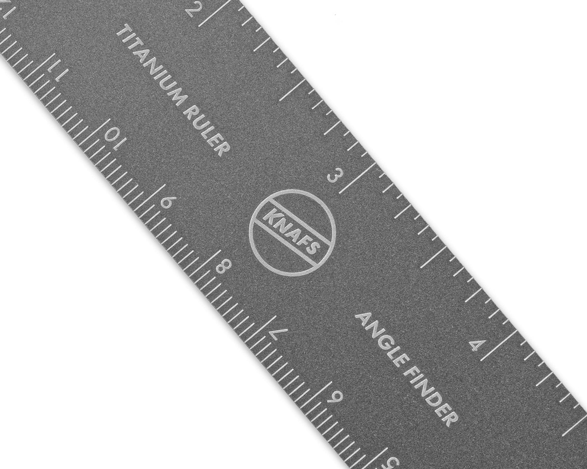 Close-up of the Titanium Ruler's center section showing inch and centimeter markings and the Knafs logo