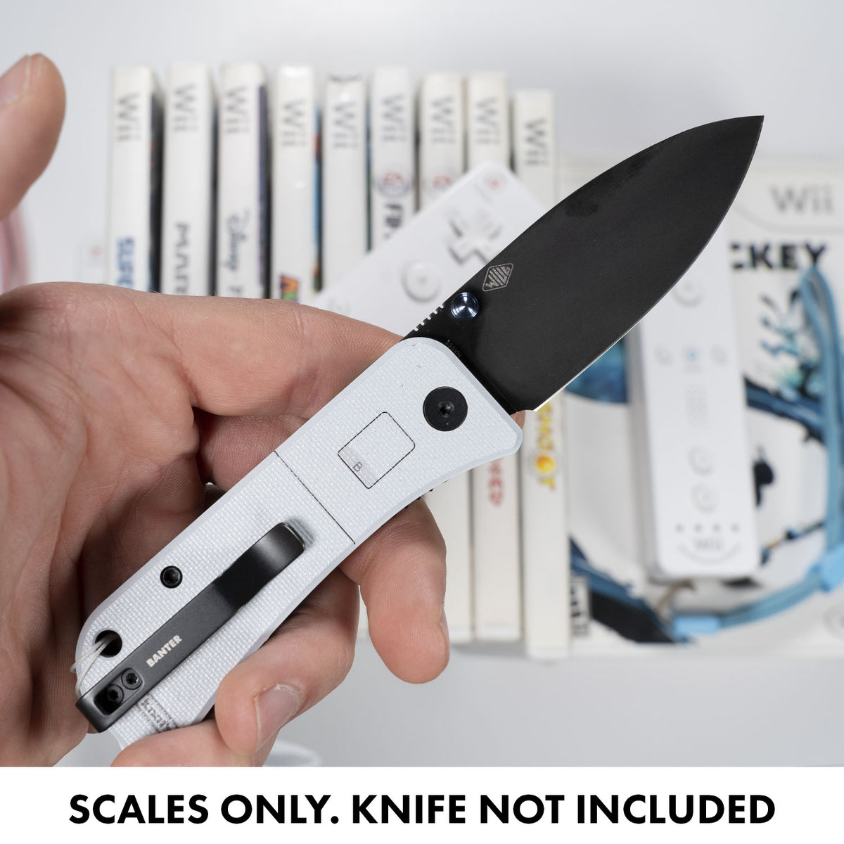 Close-up of a hand holding an open Banter knife with WEii Banter Scales installed (scales only, knife not included)