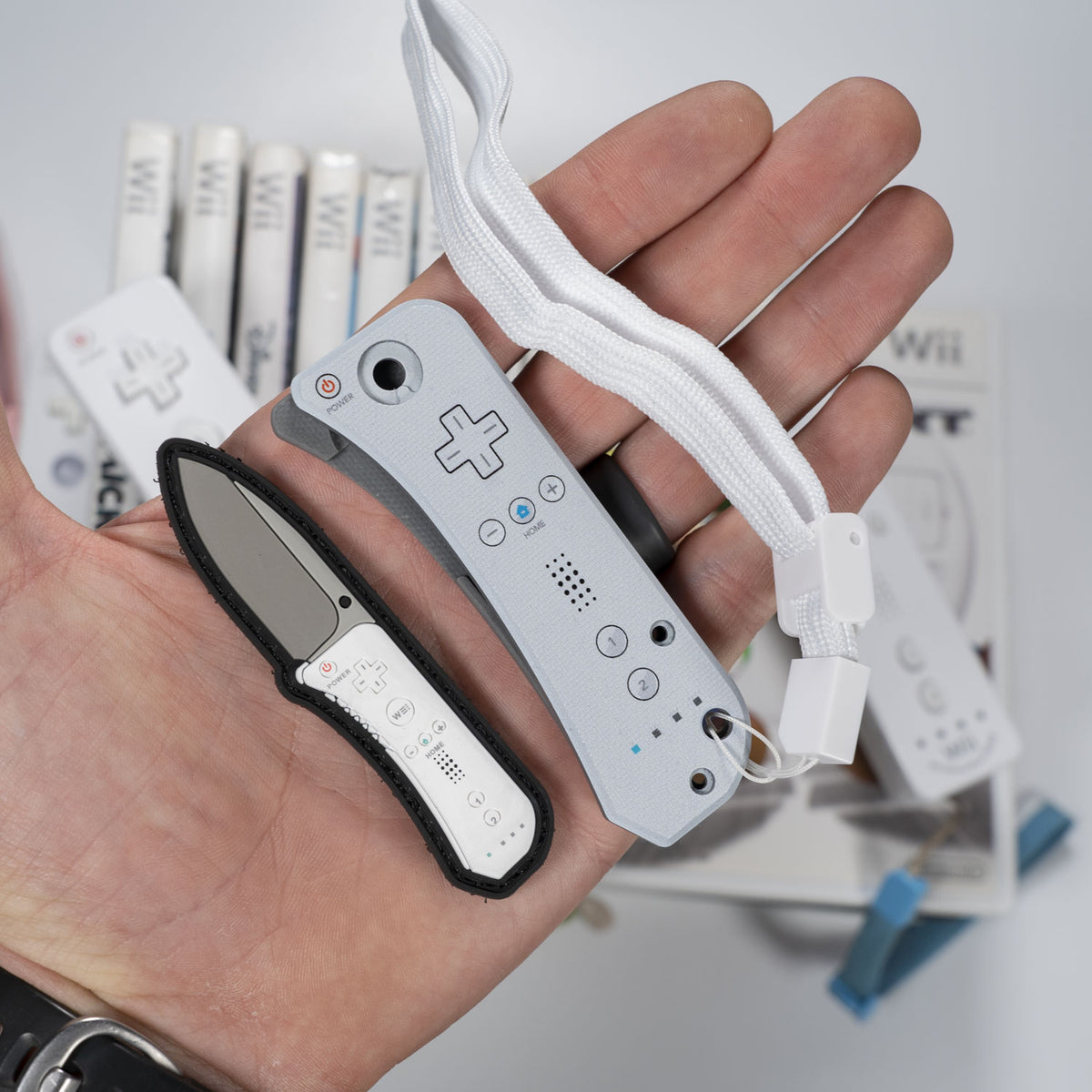 WEii Banter Scales installed on an open Banter knife, held in hand, front view